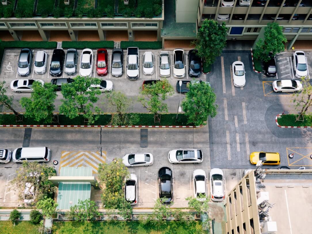 A parking lot in Texas filled with cars as they search for open parking spots