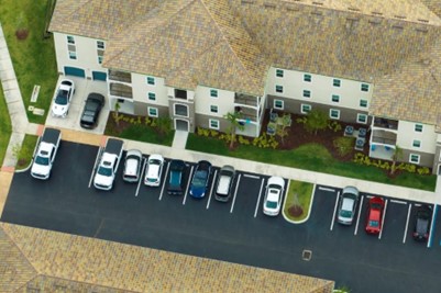 Multifamily housing parking lot at a peak time where the lot is filled with cars